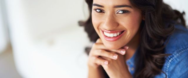 Smiling patient after receiving porcelain veneers at Allegra Dental in Tustin, CA