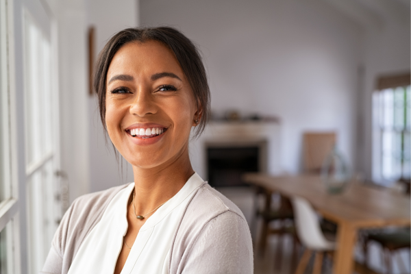 Woman with porcelain veneers smiling