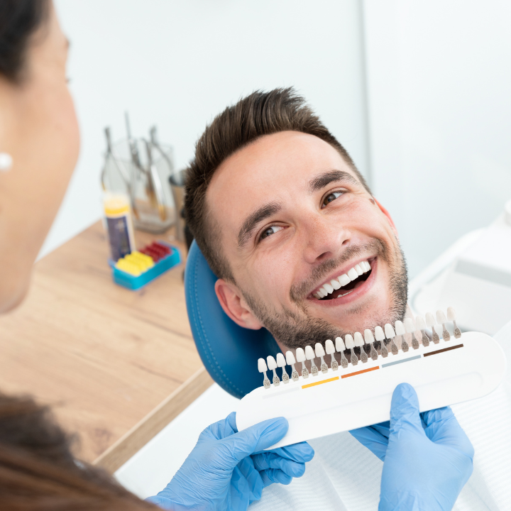 Happy patient after her porcelain veneers were placed in Tustin, CA.