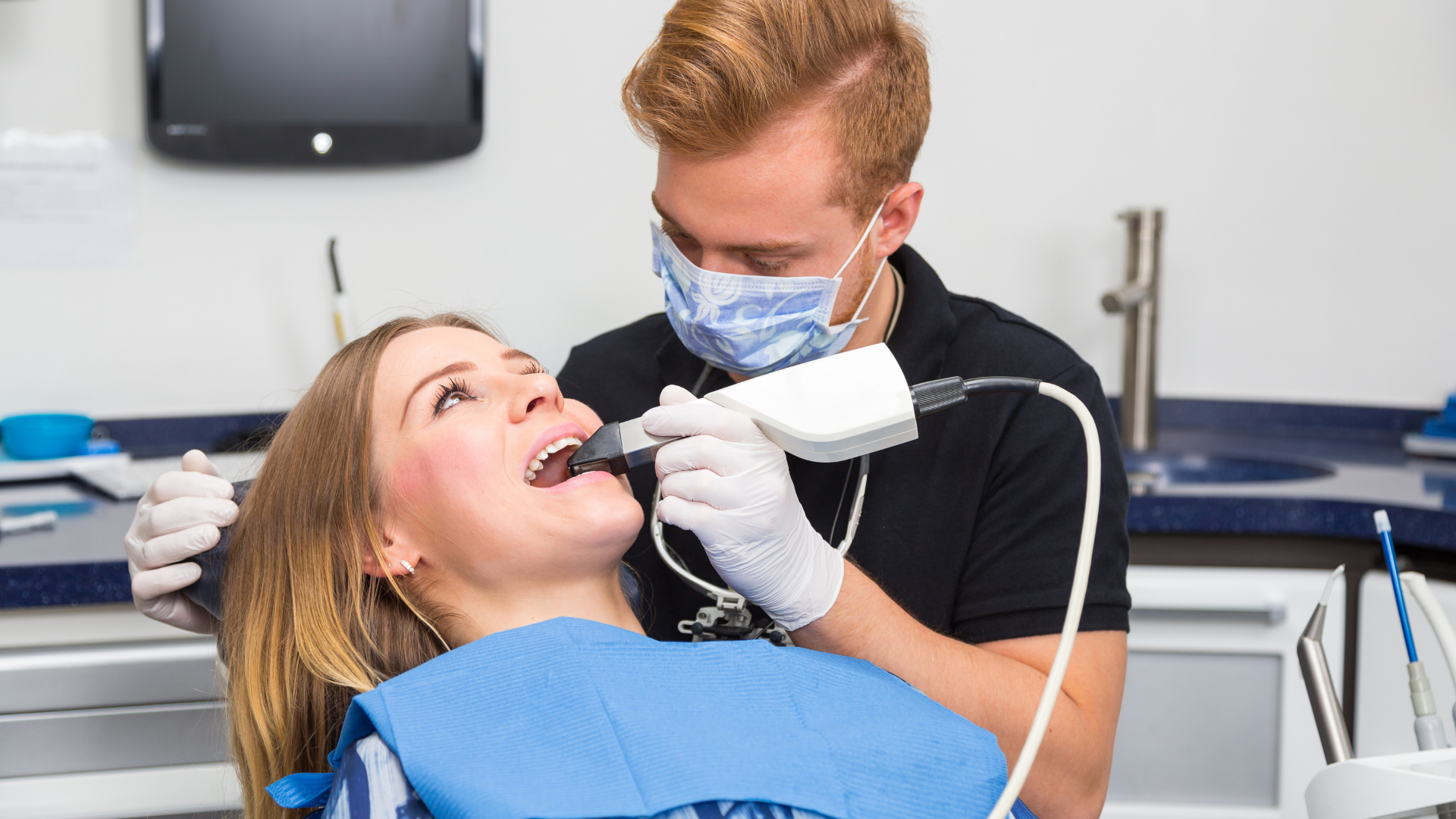 Doctor Performing CEREC Same-Day Crowns Treatment on Patient | Tustin, CA