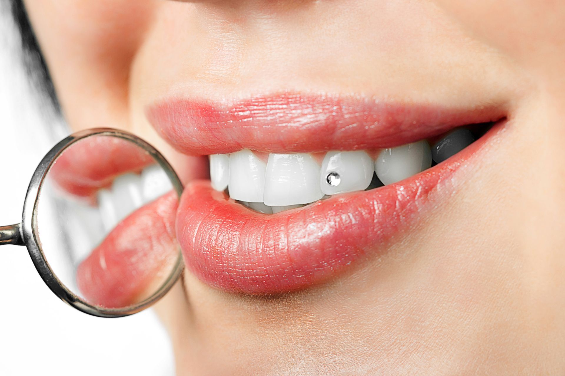 Confident Woman Smiling with Tooth Gem | Tustin, CA Cosmetic Dentistry Services