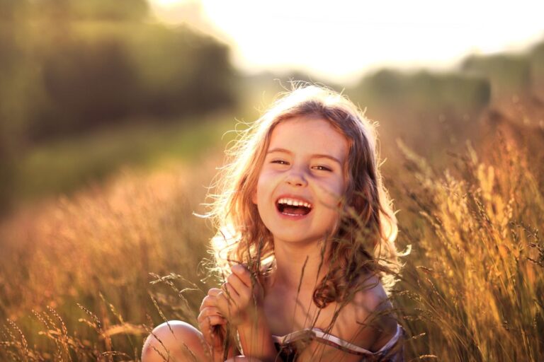 Cute Little Girl Smiling Joyfully Outdoors | General Services in Tustin, CA