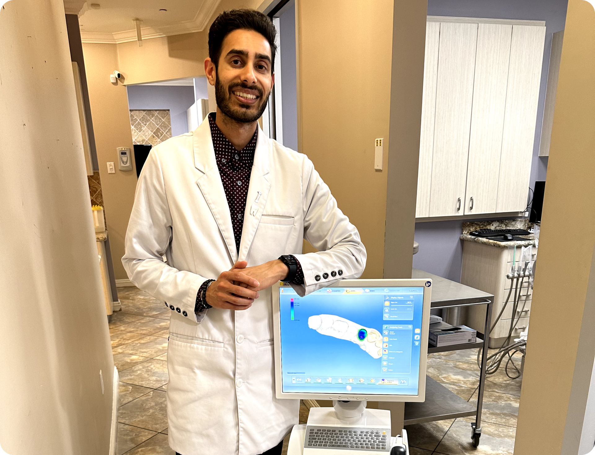 Dr. Ahmed Standing Next to Diagnostic Tools for General Services | Tustin, CA