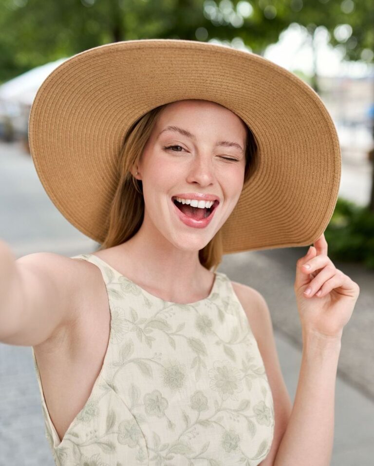 Beautiful Woman Wearing Sun Hat with Bright Smile | Cosmetic Dentistry in Tustin, CA